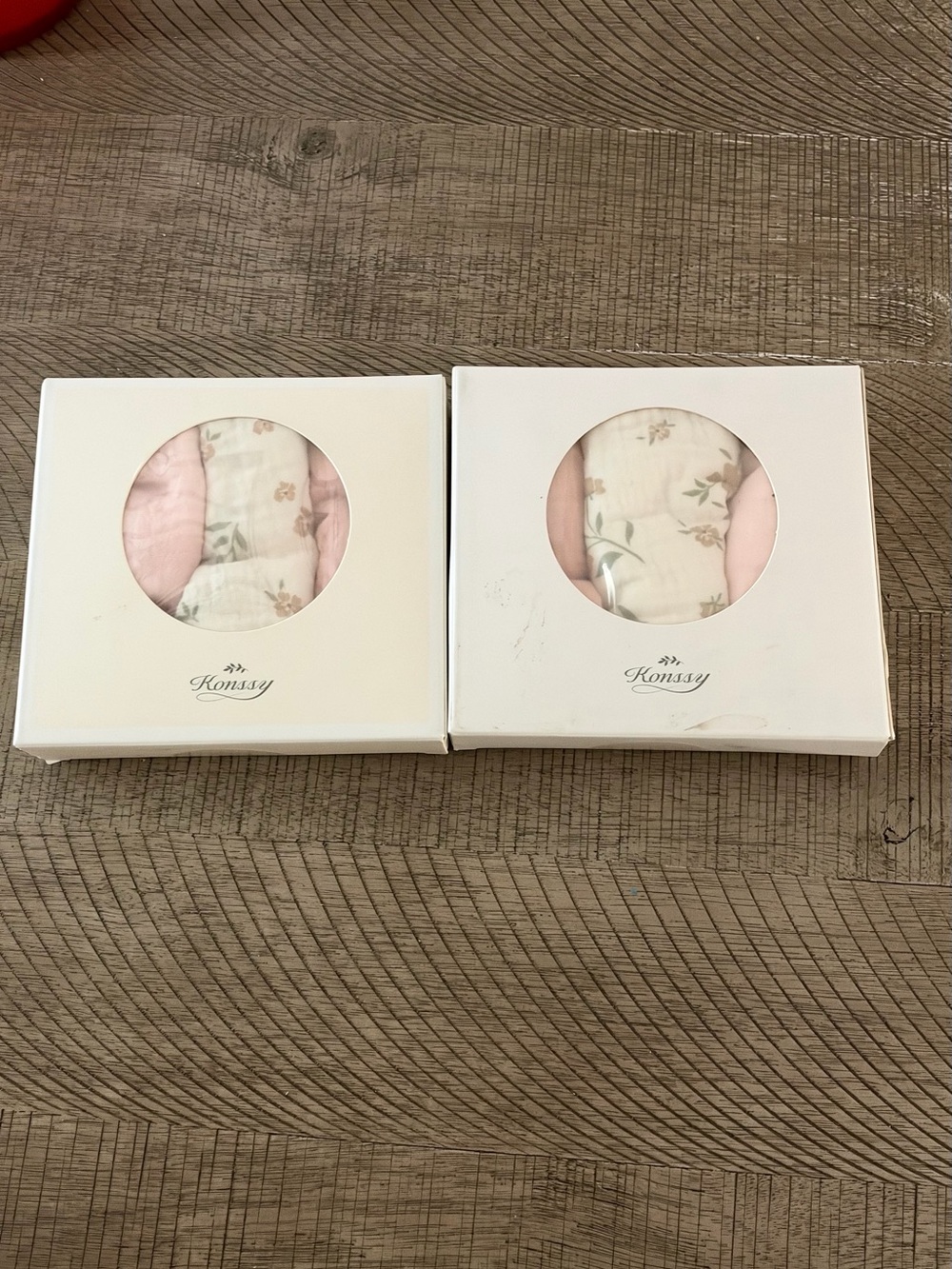 Two packs of baby girl bibs